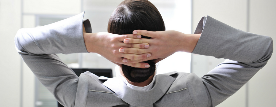 a man with his arms crossed behind his head facing the other direction