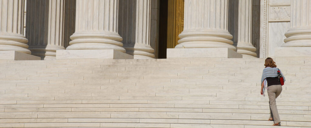 Woman walking up Steps of US Supreme Court