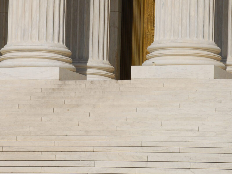 Woman walking up Steps of US Supreme Court