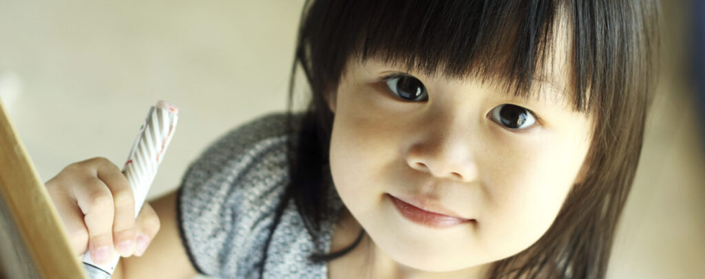 a little girl with dark hair