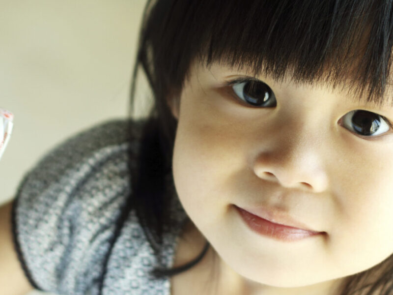 a little girl with dark hair